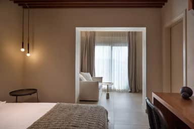 Superior Double Room with pendant lights, a work desk and a sofa nook by the curtained window